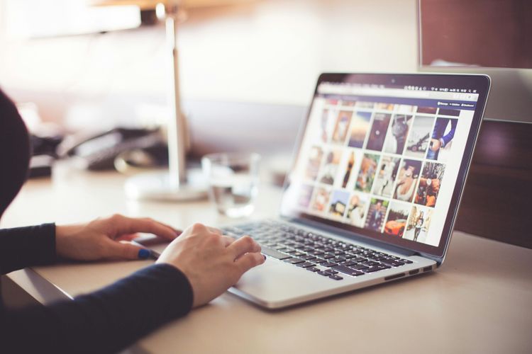 Person in front of a computer browsing internet